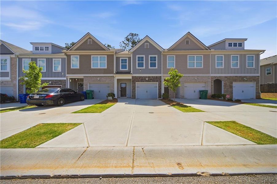 Front exterior of a new home in , Lithonia, GA, highlighting curb appeal (Image 26). Front exterior of a new home in , Lithonia, GA, highlighting curb appeal (Image 26).