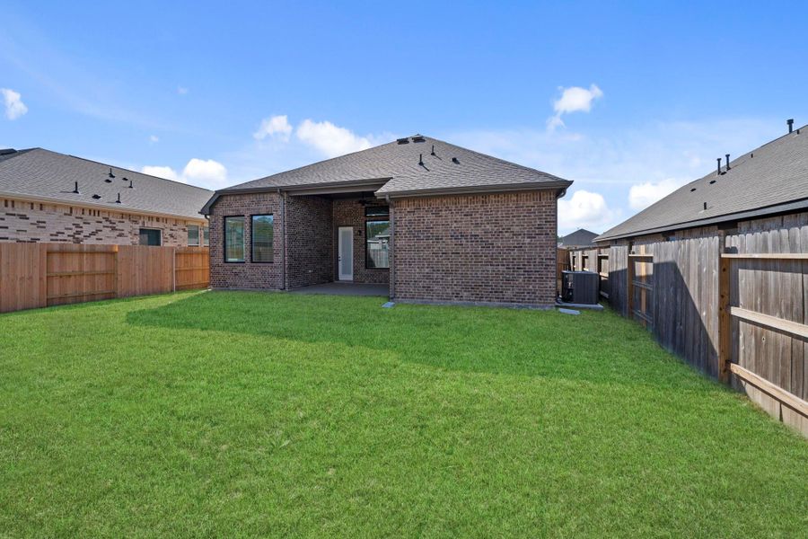 Exterior details and patio area of a home in The Trails, New Caney (Image 4).