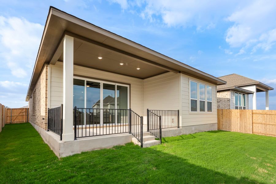 Exterior details and patio area of a home in Lariat, Liberty Hill (Image 23).