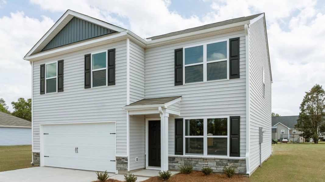 Front exterior of a new home in Blair Ridge, La Grange, NC, highlighting curb appeal (Image 22). Front exterior of a new home in Blair Ridge, La Grange, NC, highlighting curb appeal (Image 22).