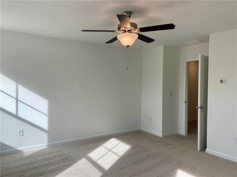 Spacious, unfurnished interior of a new home in Eastlyn Crossing, Flowery Branch (Image 20).