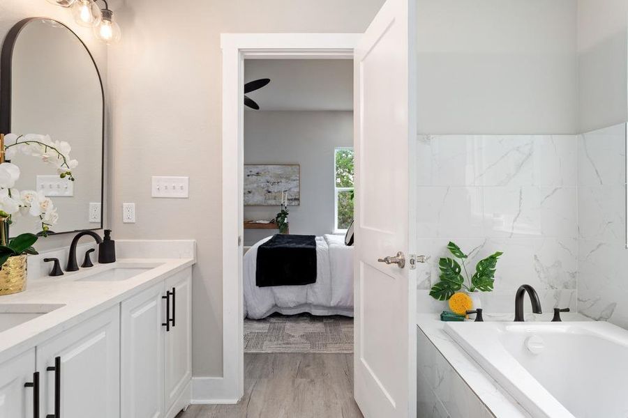 Clean lines and classic fixtures complete this serene bathroom, offering a relaxing retreat. Clean lines and classic fixtures complete this serene bathroom, offering a relaxing retreat.