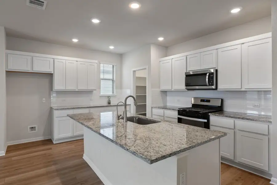 Furnished interior view inside a new home in The Ridge at Trinity Ranch, Elgin (Image 10). Furnished interior view inside a new home in The Ridge at Trinity Ranch, Elgin (Image 10).