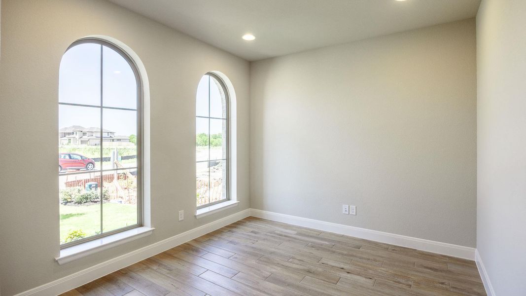 Spare room with healthy amount of natural light, light wood-style flooring, baseboards, and recessed lighting Spare room with healthy amount of natural light, light wood-style flooring, baseboards, and recessed lighting