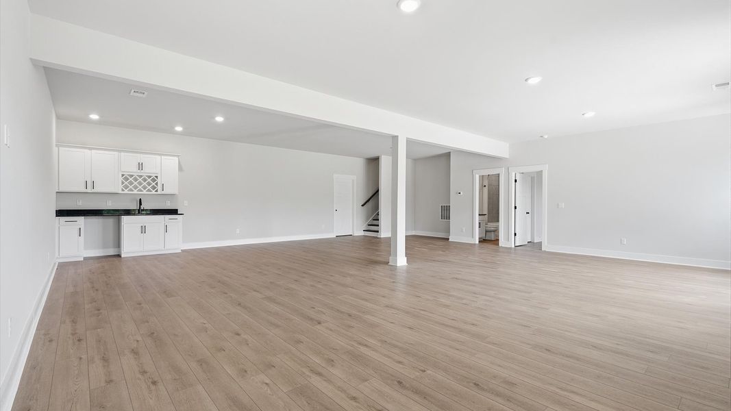 Elevate your lifestyle with a finished basement offering generous space for entertaining at the Pinebrook community