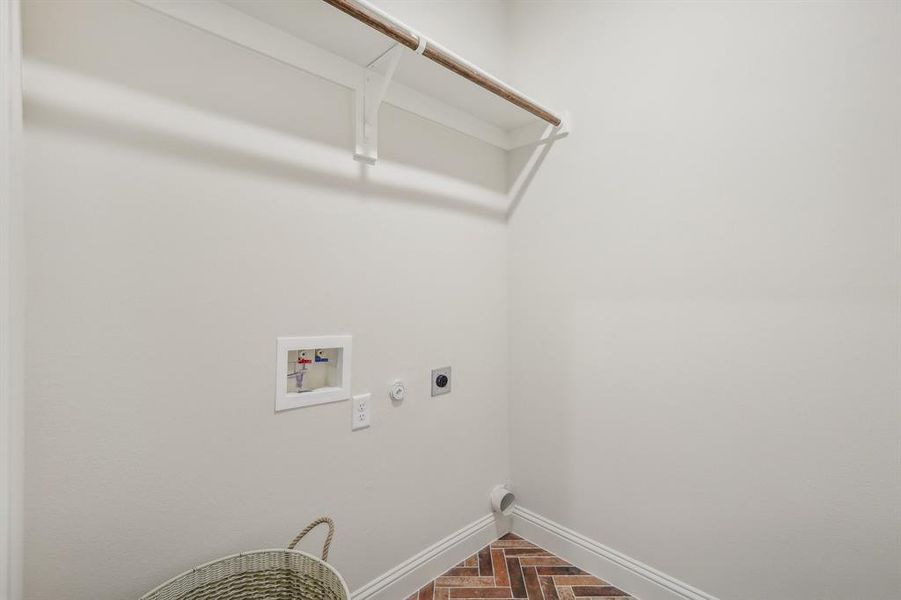 Laundry room with electric dryer hookup, gas dryer hookup, and washer hookup