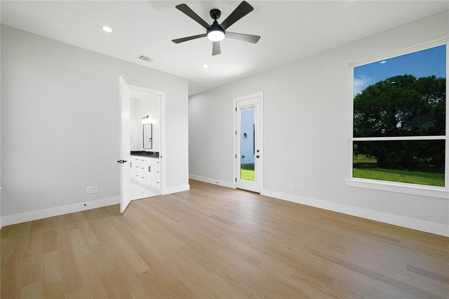 Unfurnished room with light wood-type flooring, ceiling fan, baseboards, and recessed lighting Unfurnished room with light wood-type flooring, ceiling fan, baseboards, and recessed lighting