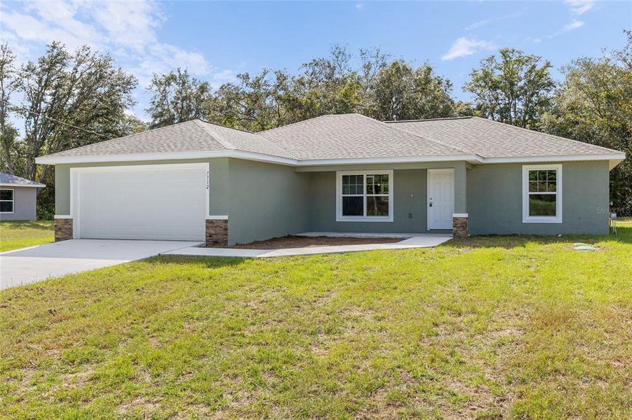 Front exterior of a new home in , Ocala, FL, highlighting curb appeal (Image 2). Front exterior of a new home in , Ocala, FL, highlighting curb appeal (Image 2).