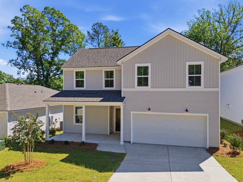 Front exterior of a new home in Grand Arbor, Blythewood, SC, highlighting curb appeal (Image 2). Front exterior of a new home in Grand Arbor, Blythewood, SC, highlighting curb appeal (Image 2).