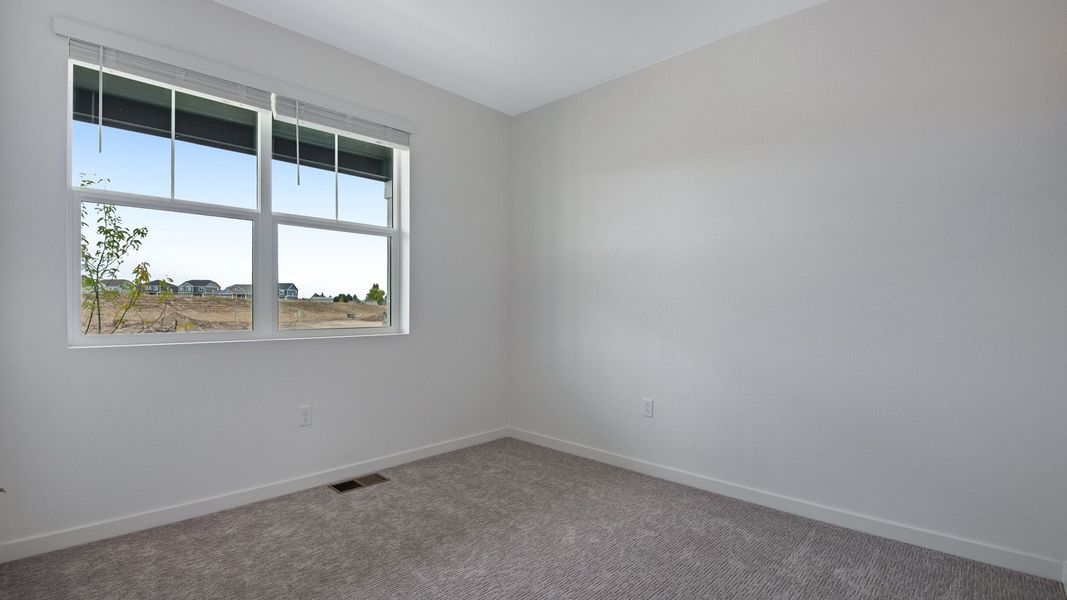 Spacious, unfurnished interior of a new home in Trails at Crowfoot, Parker (Image 20).