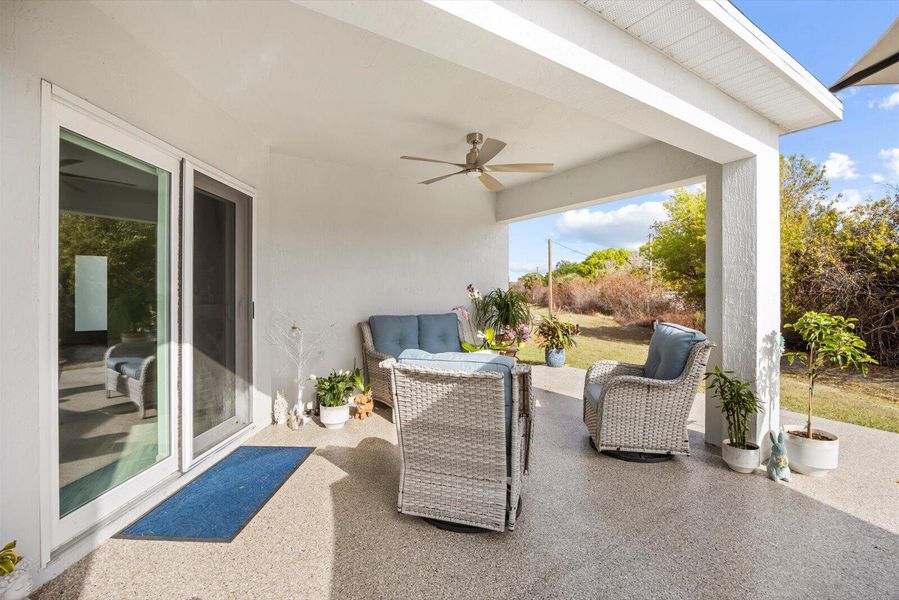 Covered Lanai with Impact Sliding Glass Doors & Ceiling Fans