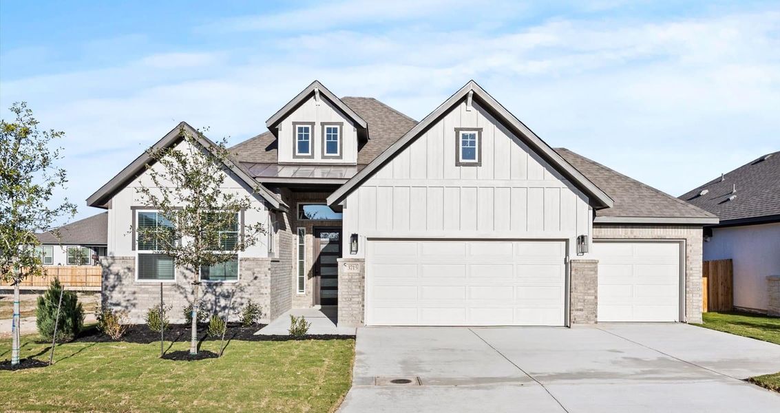Front exterior of a new home in Village at Three Oaks, Seguin, TX, highlighting curb appeal (Image 1). Front exterior of a new home in Village at Three Oaks, Seguin, TX, highlighting curb appeal (Image 1).