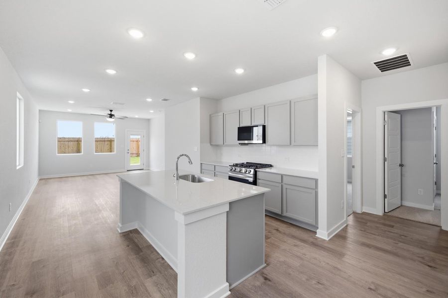 Furnished interior view inside a new home in Stallion Run, Buda (Image 7).