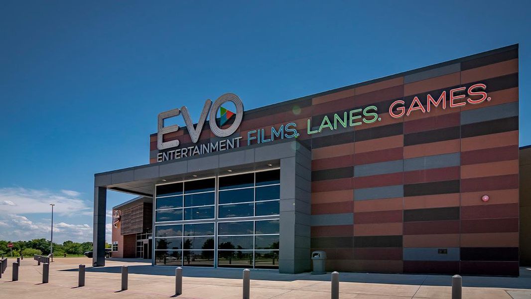 Front exterior of a new home in Paramount, Kyle, TX, highlighting curb appeal (Image 12).