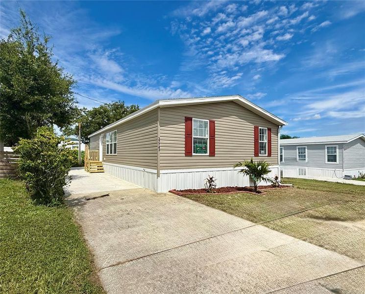 Front exterior of a new home in , Zephyrhills, FL, highlighting curb appeal (Image 12).