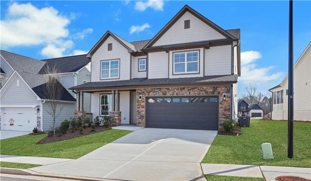 Front exterior of a new home in Twin Lakes, Hoschton, GA, highlighting curb appeal (Image 21).