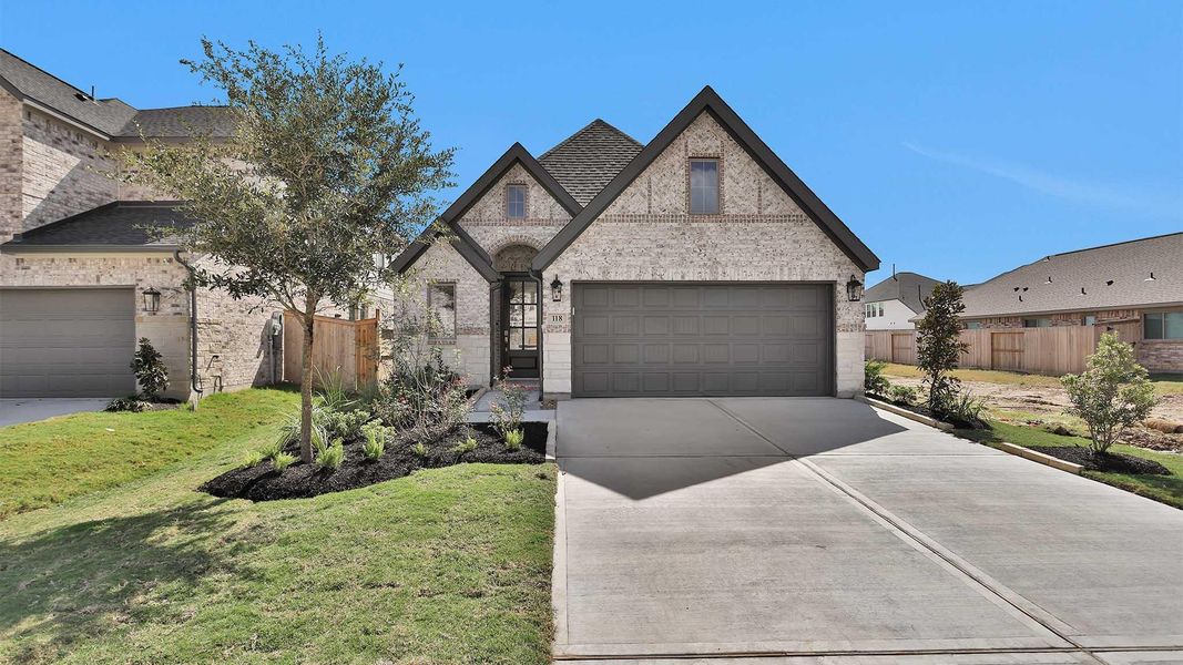 Front exterior of a new home in Candela South 40', Richmond, TX, highlighting curb appeal (Image 1). Front exterior of a new home in Candela South 40', Richmond, TX, highlighting curb appeal (Image 1).