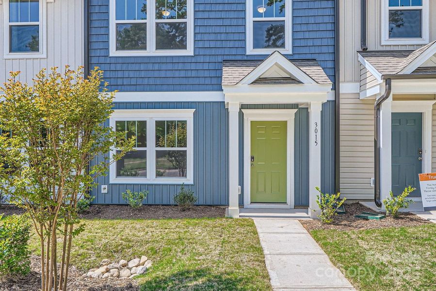 Front exterior of a new home in Dukes Ridge, Charlotte, NC, highlighting curb appeal (Image 23).