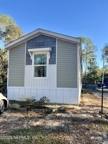 Exterior details and patio area of a home in , Satsuma (Image 17). Exterior details and patio area of a home in , Satsuma (Image 17).