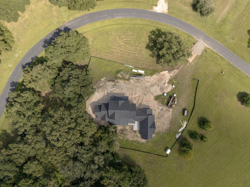 Front exterior of a new home in , Wadmalaw Island, SC, highlighting curb appeal (Image 13). Front exterior of a new home in , Wadmalaw Island, SC, highlighting curb appeal (Image 13).
