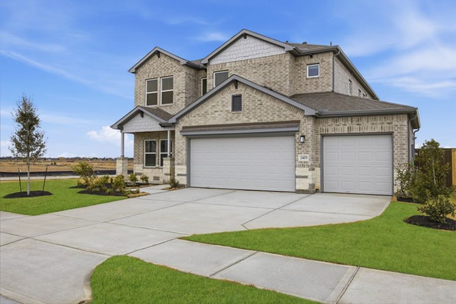 Front exterior of a new home in Creekhaven, Iowa Colony, TX, highlighting curb appeal (Image 18).