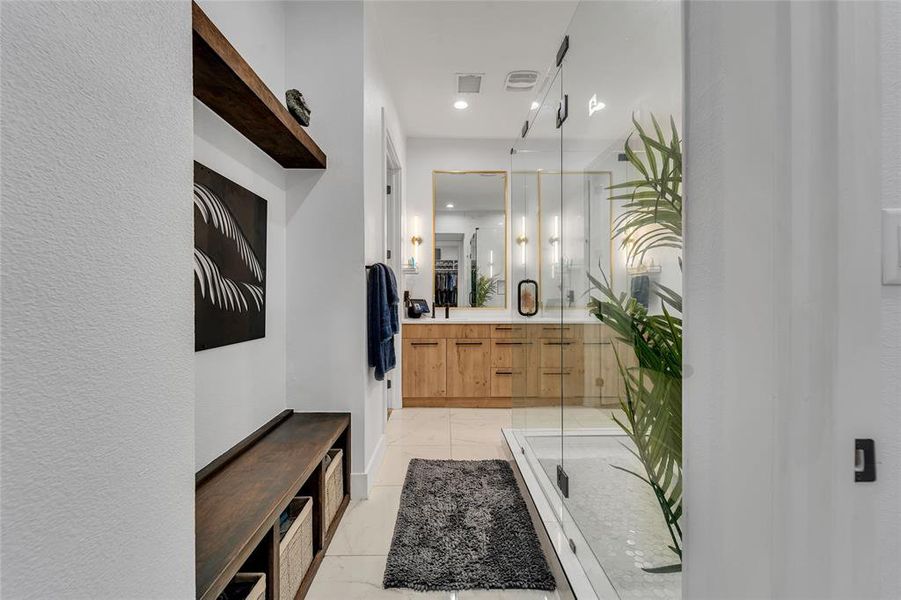 Full bathroom featuring double vanity, a shower stall, and recessed lighting Full bathroom featuring double vanity, a shower stall, and recessed lighting