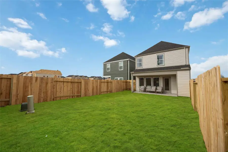 Exterior details and patio area of a home in Grand West, Houston (Image 3).