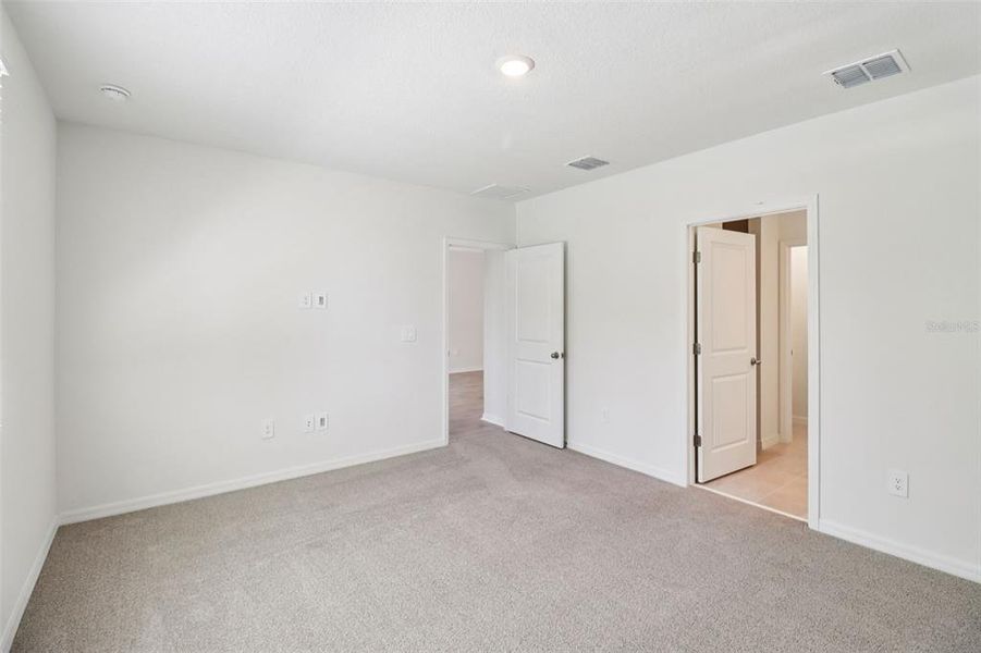 Spacious, unfurnished interior of a new home in Ridgehaven - Villas, Ormond Beach (Image 28).