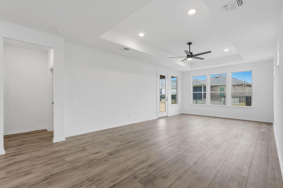 Large windows and a seamless layout fill this living space with natural light, creating a bright, airy setting ideal for everyday living.