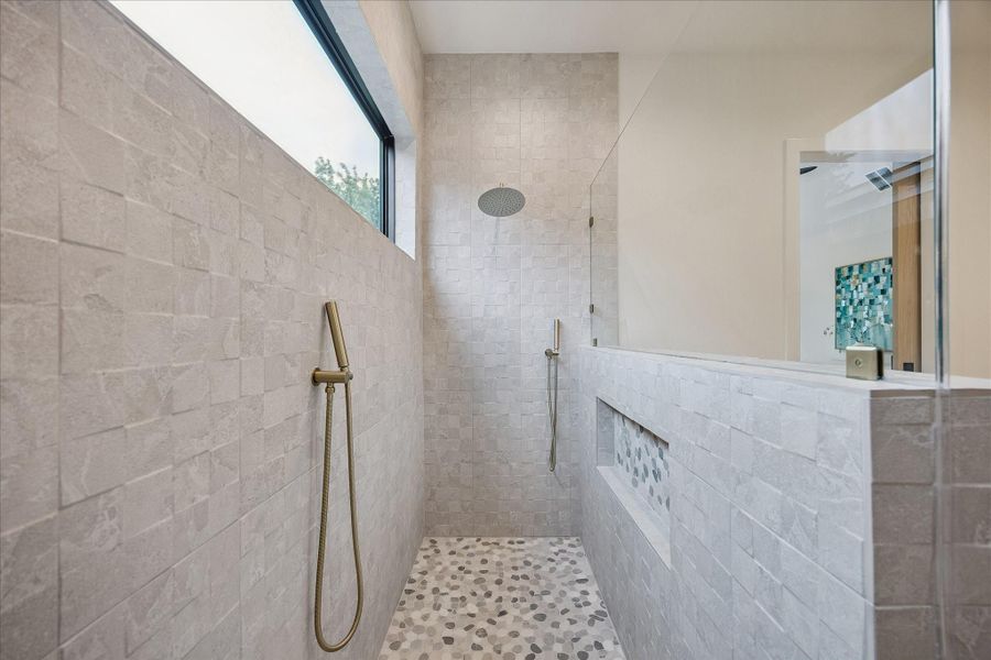Spacious shower with double shower heads. Spacious shower with double shower heads.