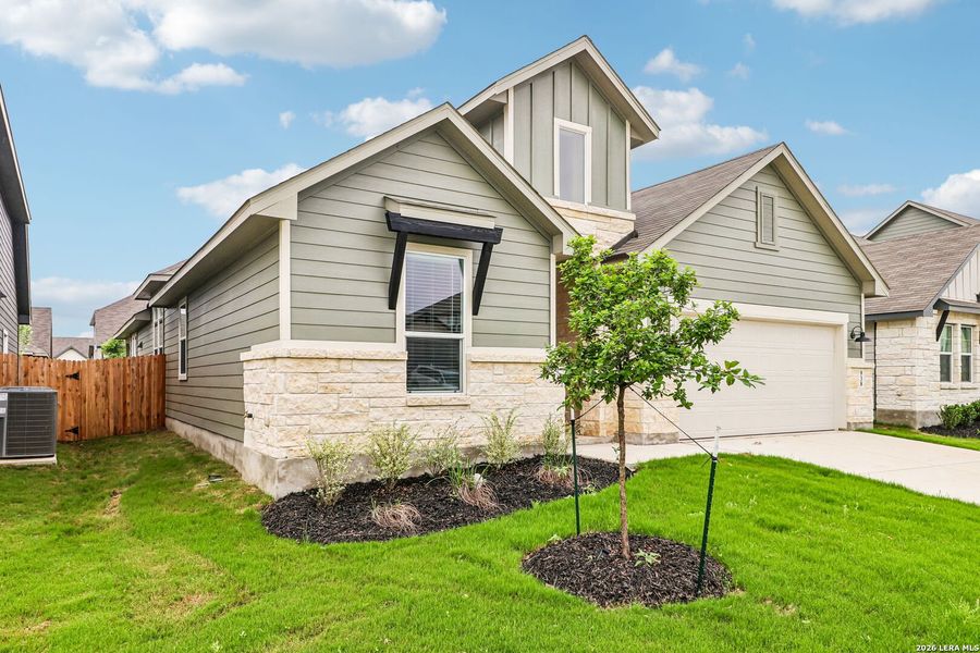 Front exterior of a new home in Estancia Ranch - Classic Series, San Antonio, TX, highlighting curb appeal (Image 29).
