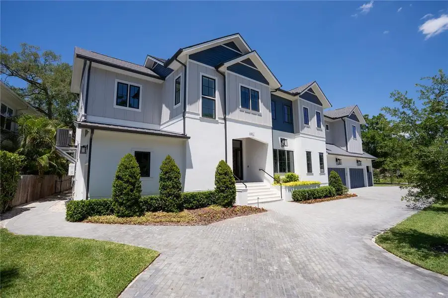 Front exterior of a new home in , Tampa, FL, highlighting curb appeal (Image 25).