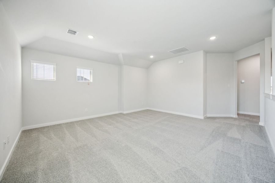 Game room in the Masters home plan by Trophy Signature Homes – REPRESENTATIVE PHOTO