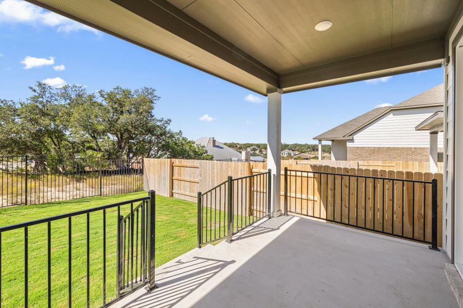 Exterior details and patio area of a home in Lariat, Liberty Hill (Image 23).