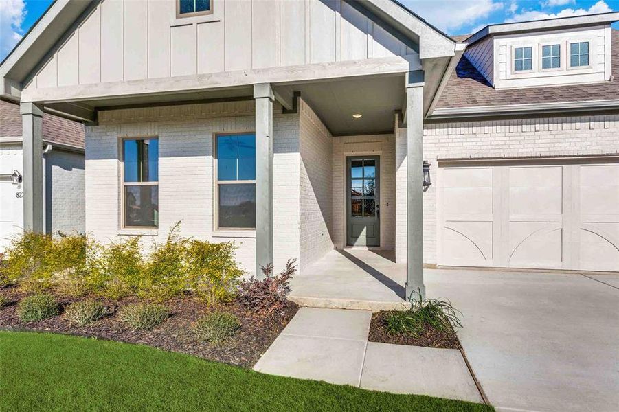 Doorway to property with a garage