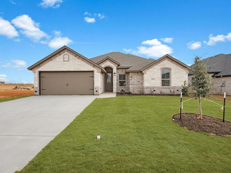 Front exterior of a new home in , Tolar, TX, highlighting curb appeal (Image 23). Front exterior of a new home in , Tolar, TX, highlighting curb appeal (Image 23).