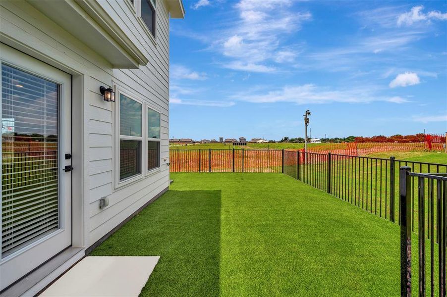 Exterior details and patio area of a home in Providence Commons, Providence Village (Image 3).