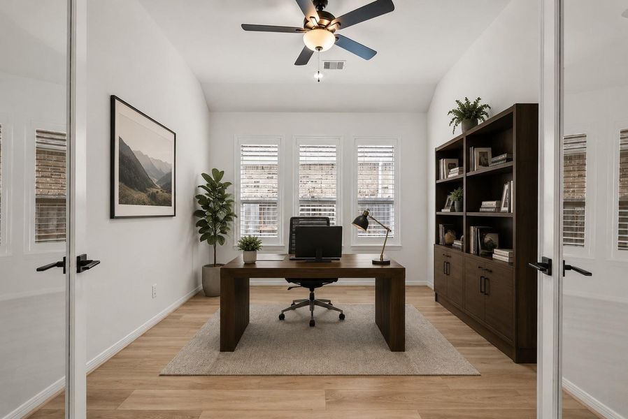 The private home office with French doors offers the perfect space for working from home or a quiet retreat.