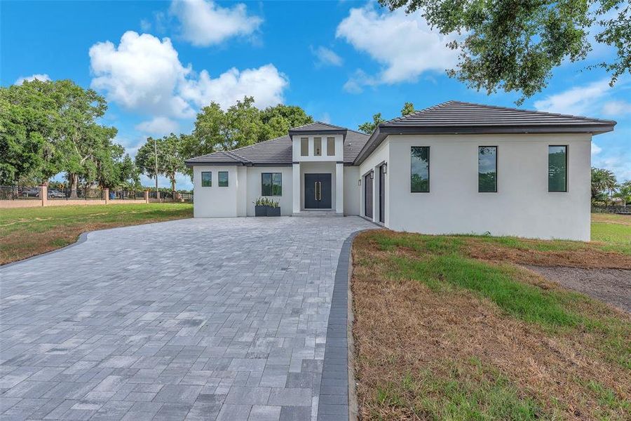 Front exterior of a new home in , Thonotosassa, FL, highlighting curb appeal (Image 24).