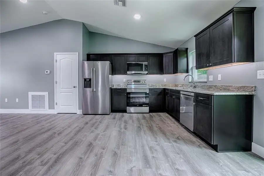 Furnished interior view inside a new home in , Lake Panasoffkee (Image 6).