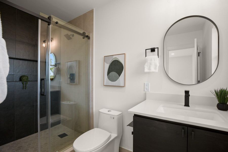 Full bath featuring vanity and a stall shower