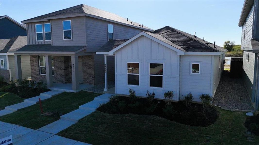 Front exterior of a new home in Orchard Village, Fort Worth, TX, highlighting curb appeal (Image 13).