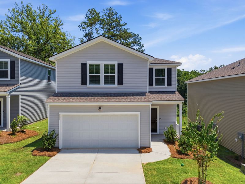 Front exterior of a new home in Grand Arbor, Blythewood, SC, highlighting curb appeal (Image 19). Front exterior of a new home in Grand Arbor, Blythewood, SC, highlighting curb appeal (Image 19).