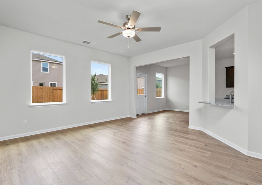The living room has two large windows that let in great, natural light and backyard views. The living room has two large windows that let in great, natural light and backyard views.