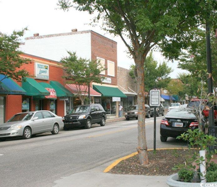 View of asphalt road with curbs