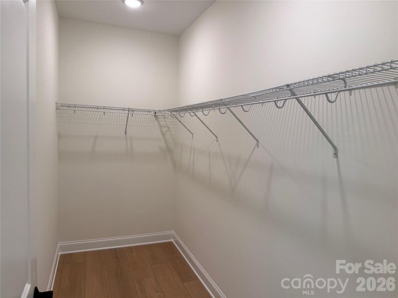 Spacious walk-in closet in the primary bedroom