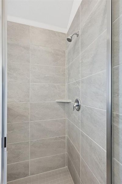 Full bath with a shower stall