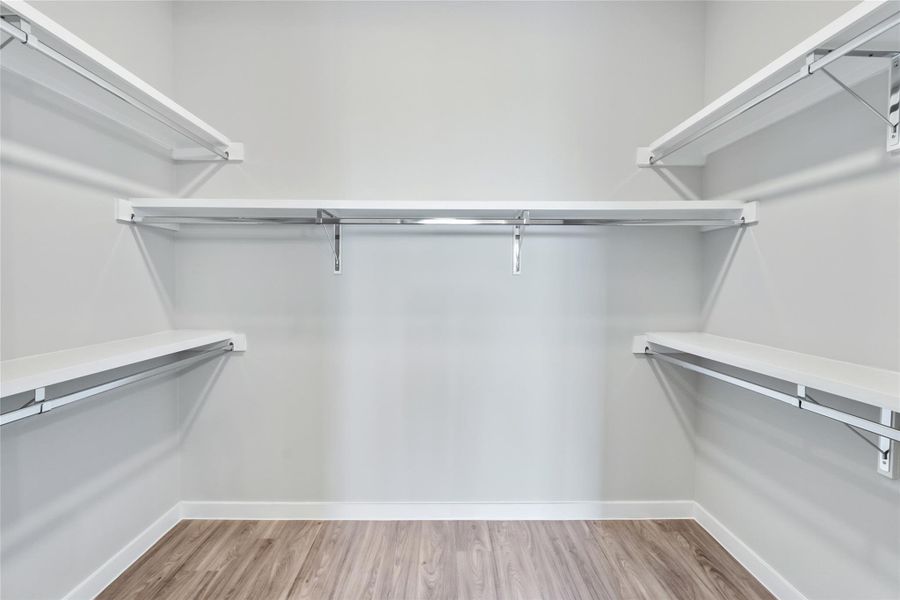 Walk in closet featuring wood finished floors
