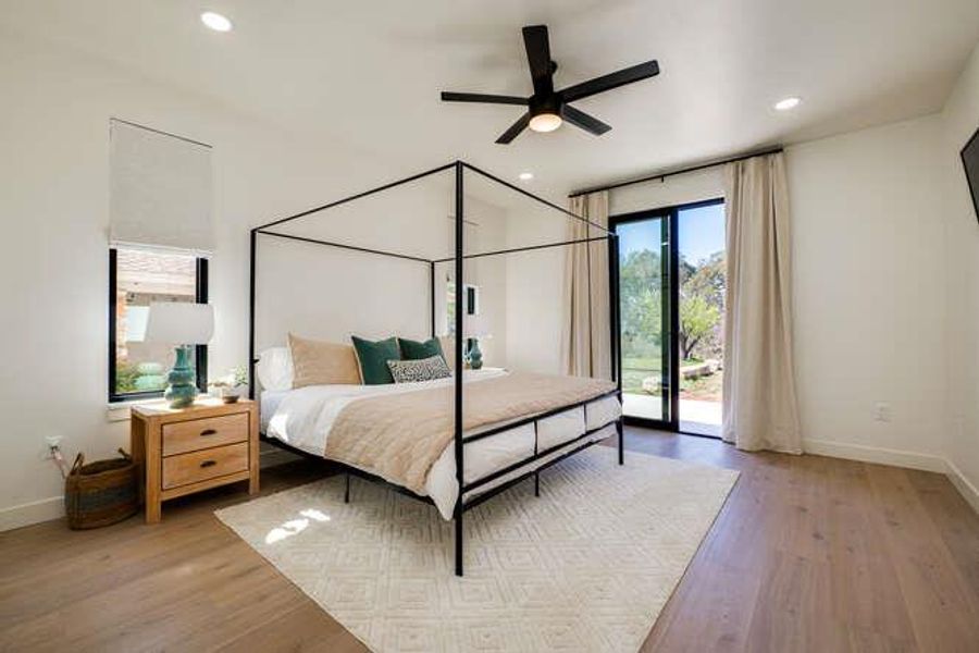 Bedroom with access to outside, recessed lighting, a ceiling fan, and light wood-style flooring