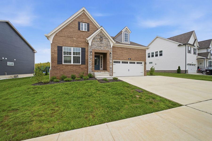 Front exterior of a new home in The Retreat at Norman Farm, Hendersonville, TN, highlighting curb appeal (Image 2).